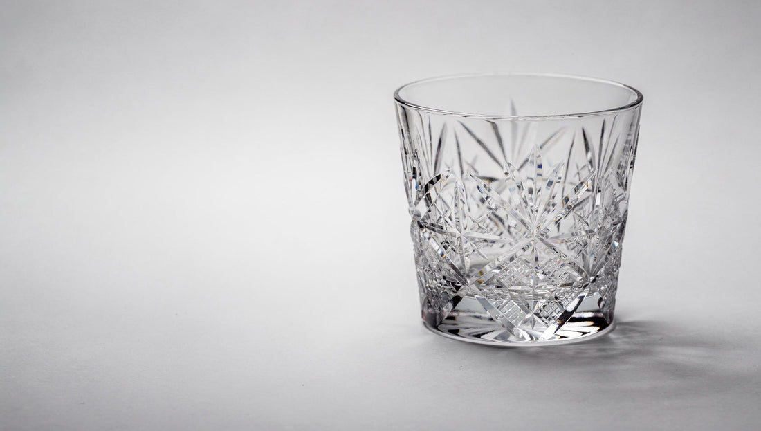 One Japanese cut-glass rocks glass on a pale table, three-quarter product view as if choosing it online.