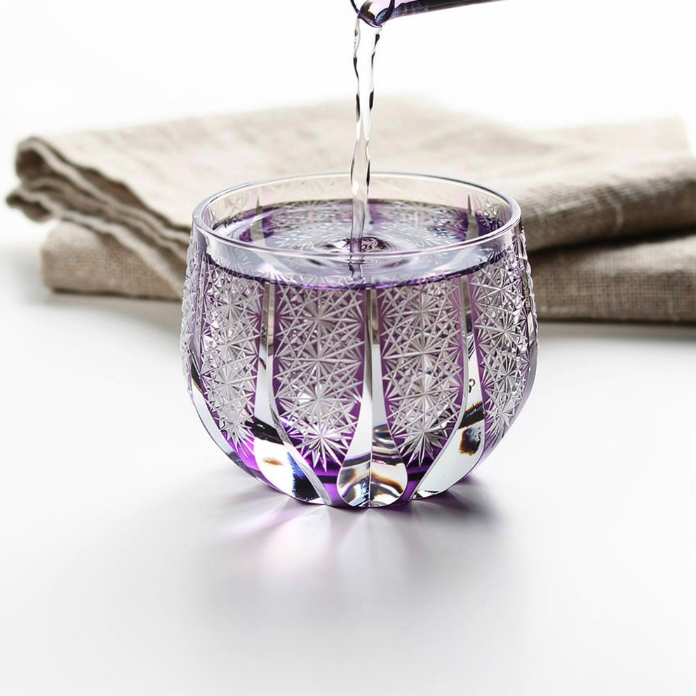 Ruby First Pour Sake Glass, shown with a sake pour